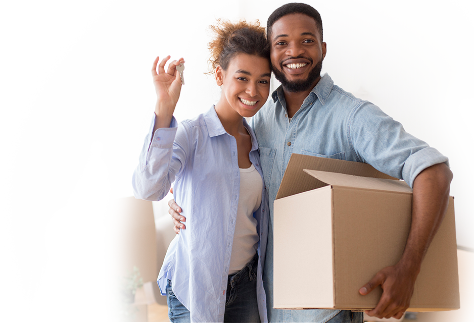 Couple with boxes moving into new home