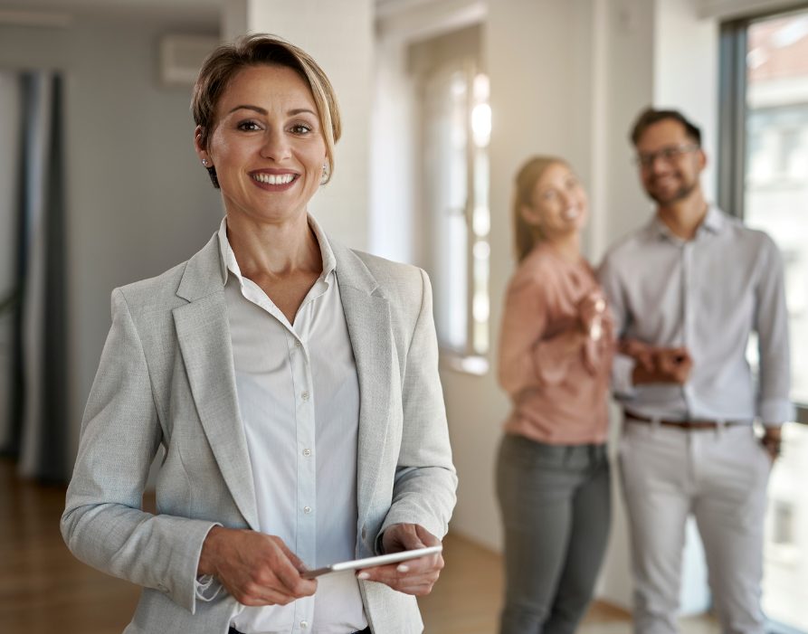 Portrait of happy female real estate agent.
